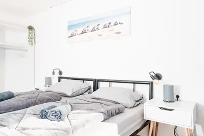 Ein Bett oder Betten in einem Zimmer der Unterkunft Lichtdurchflutetes City-Apartment mit 5 Betten