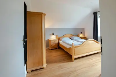Ein Bett oder Betten in einem Zimmer der Unterkunft Gästehaus & Weingut Volker Schmitt