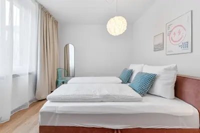 Ein Bett oder Betten in einem Zimmer der Unterkunft WHONAP - NØMY I Küche I Zentral I Balkon I Business