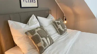 Ein Bett oder Betten in einem Zimmer der Unterkunft Design Apartment Gruppen & Business 10 min zu SAP