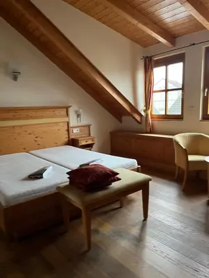 Ein Bett oder Betten in einem Zimmer der Unterkunft Landhotel Dohlmühle