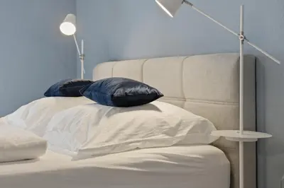Ein Bett oder Betten in einem Zimmer der Unterkunft Stilvolle Ferienwohnung im historischen Zentrum für 6 Personen und Parkplatz
