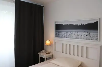 Ein Bett oder Betten in einem Zimmer der Unterkunft Hotel Regina