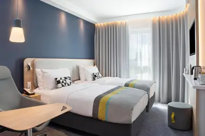 Ein Bett oder Betten in einem Zimmer der Unterkunft Holiday Inn Express Karlsruhe - City Park by IHG