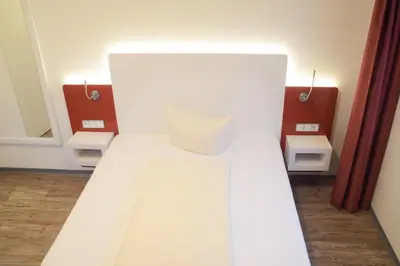 Ein Bett oder Betten in einem Zimmer der Unterkunft Hotel Arts