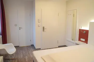 Ein Bett oder Betten in einem Zimmer der Unterkunft Hotel Arts