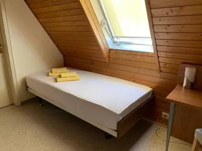 Ein Bett oder Betten in einem Zimmer der Unterkunft Gästehaus an der Rheinbrücke