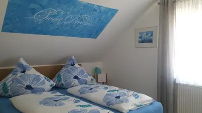 Ein Bett oder Betten in einem Zimmer der Unterkunft Gästehaus Bacchus