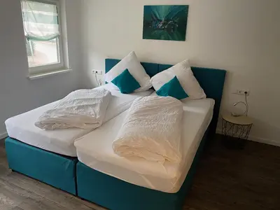 Ein Bett oder Betten in einem Zimmer der Unterkunft Ferienwohnungen Schwarzwaldpforte