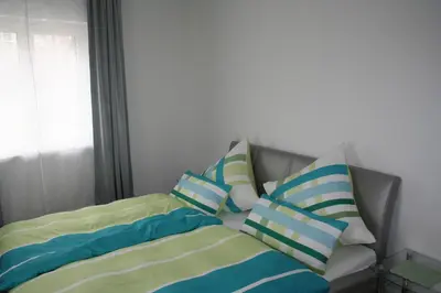 Ein Bett oder Betten in einem Zimmer der Unterkunft Ferienwohnung zur Stadtmauer