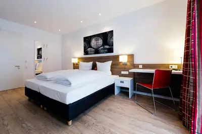 Ein Bett oder Betten in einem Zimmer der Unterkunft SCHLAFGUT Domhof erleben