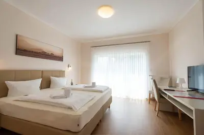 Ein Bett oder Betten in einem Zimmer der Unterkunft Kraichgauhotel