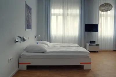 Ein Bett oder Betten in einem Zimmer der Unterkunft Baumann & Müller
