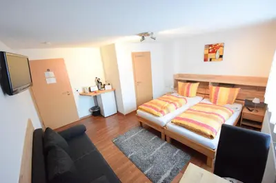 Ein Bett oder Betten in einem Zimmer der Unterkunft Gästehaus Neckarsulm