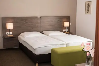 Ein Bett oder Betten in einem Zimmer der Unterkunft Hotel Wagner Am Marktplatz