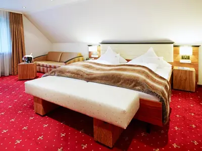 Ein Bett oder Betten in einem Zimmer der Unterkunft Naturhotel Rügers Forstgut
