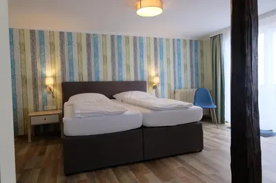 Ein Bett oder Betten in einem Zimmer der Unterkunft Zum Weissen Lamm