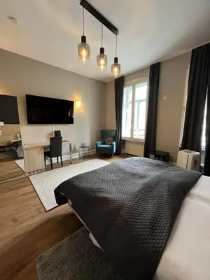 Ein Bett oder Betten in einem Zimmer der Unterkunft Denner Hotel