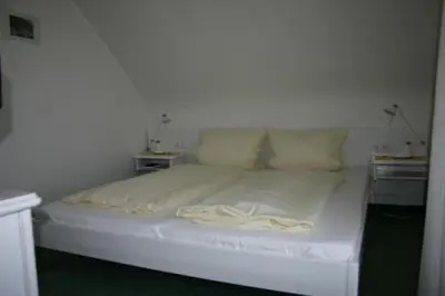Ein Bett oder Betten in einem Zimmer der Unterkunft Hotel Café Talblick