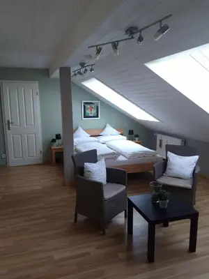 Ein Bett oder Betten in einem Zimmer der Unterkunft Rheinauer Hof - bed & breakfast