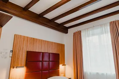 Ein Bett oder Betten in einem Zimmer der Unterkunft Hotel & Gasthaus Backmulde