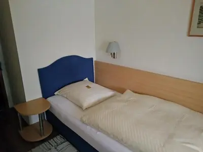 Ein Bett oder Betten in einem Zimmer der Unterkunft Hotel Alfa