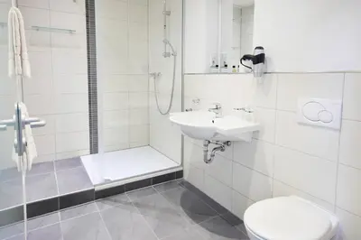 Ein Badezimmer in der Unterkunft Hotel Villa-Bassermann, stilvoll, 2 Min zum Schloss, schnelles WLAN & Parkplatz