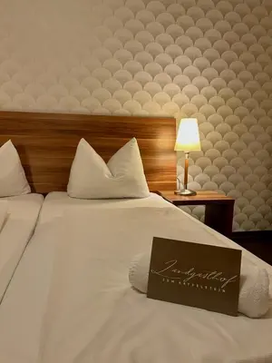 Ein Bett oder Betten in einem Zimmer der Unterkunft Hotel Landgasthof zum Kaffelstein