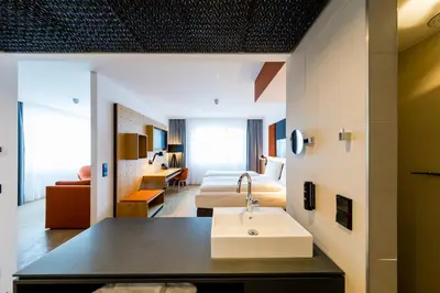 Ein Bett oder Betten in einem Zimmer der Unterkunft mk | hotel rüsselsheim