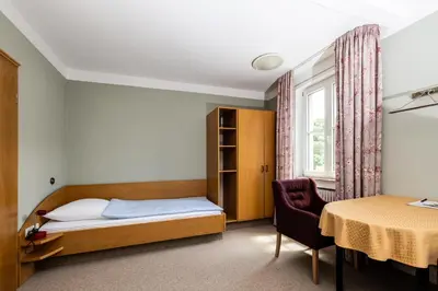 Ein Bett oder Betten in einem Zimmer der Unterkunft Gästehaus in der Brückenstraße Jagsthausen