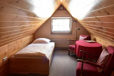 Ein Bett oder Betten in einem Zimmer der Unterkunft Gästehaus in der Brückenstraße Jagsthausen