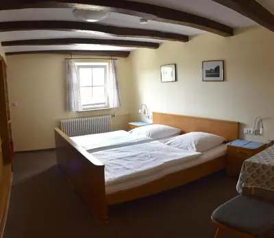 Ein Bett oder Betten in einem Zimmer der Unterkunft Gästehaus in der Brückenstraße Jagsthausen