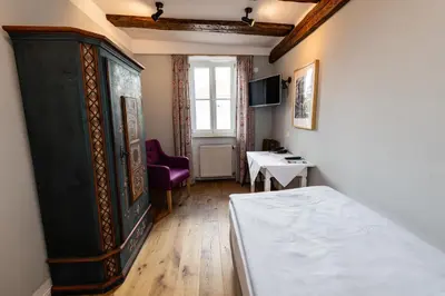 Ein Bett oder Betten in einem Zimmer der Unterkunft Gästehaus in der Brückenstraße Jagsthausen
