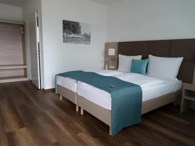 Ein Bett oder Betten in einem Zimmer der Unterkunft Altes Ruderhaus