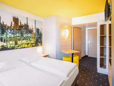 Ein Bett oder Betten in einem Zimmer der Unterkunft B&B Hotel Ludwigshafen