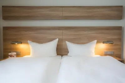 Ein Bett oder Betten in einem Zimmer der Unterkunft Hotel & Restaurant Rose