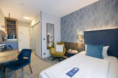 Ein Bett oder Betten in einem Zimmer der Unterkunft Hotel & Restaurant Rose