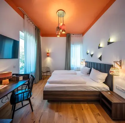Ein Bett oder Betten in einem Zimmer der Unterkunft acor Boutique Hotel
