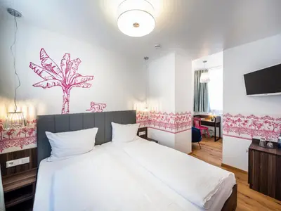 Ein Bett oder Betten in einem Zimmer der Unterkunft acor Boutique Hotel