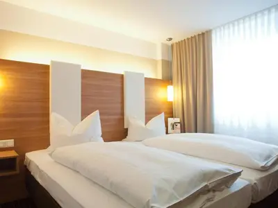 Ein Bett oder Betten in einem Zimmer der Unterkunft Sunny´s Hotel & Residence