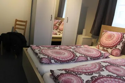 Ein Bett oder Betten in einem Zimmer der Unterkunft Bismarck Hostel Öhringen