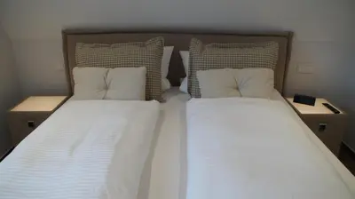 Ein Bett oder Betten in einem Zimmer der Unterkunft Boardinghaus Götterhimmel
