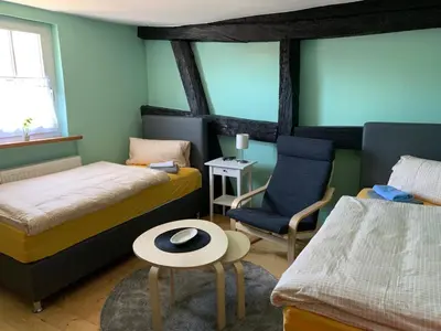 Ein Bett oder Betten in einem Zimmer der Unterkunft Gästehaus Windheim (Karlsruher Denkmal)