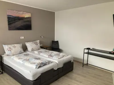 Ein Bett oder Betten in einem Zimmer der Unterkunft Boardinghouse Alte Bank