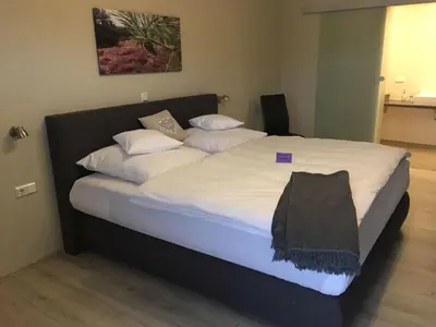 Ein Bett oder Betten in einem Zimmer der Unterkunft Boardinghouse Alte Bank