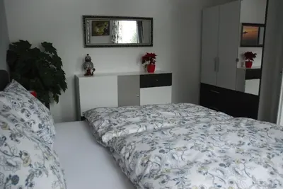 Ein Bett oder Betten in einem Zimmer der Unterkunft Am Berggarten