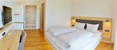 Ein Bett oder Betten in einem Zimmer der Unterkunft Gästehaus Rebenhof