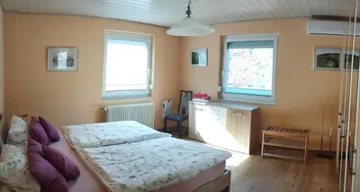 Ein Bett oder Betten in einem Zimmer der Unterkunft Nichtraucherferienwohnung-Neckarblick ZE-2022-74-WZ-118A