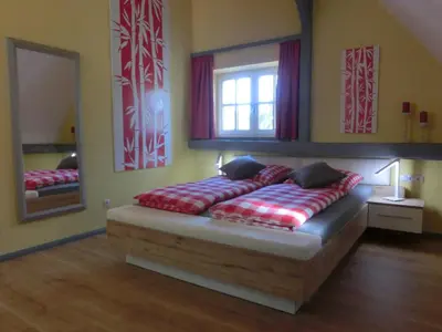 Ein Bett oder Betten in einem Zimmer der Unterkunft Ferienhaus Cartoonwerkstatt