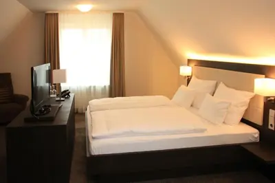 Ein Bett oder Betten in einem Zimmer der Unterkunft Alte Schmiede